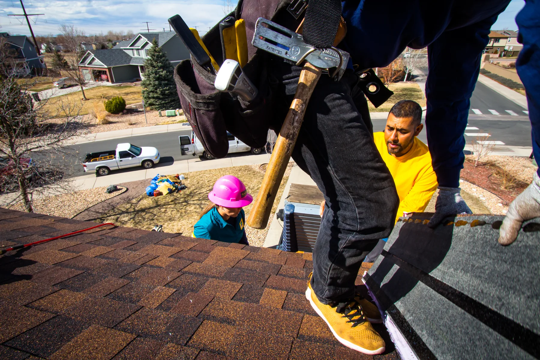 BossLady roofing crew installing shingles on a Denver-area home