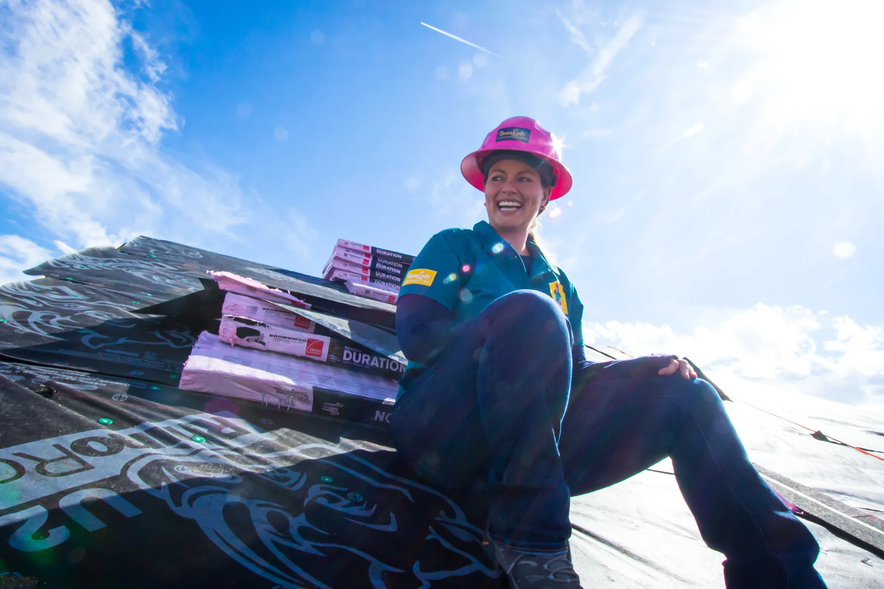 Alex Crawfurd working alongside a roofing crew on a Denver-area home